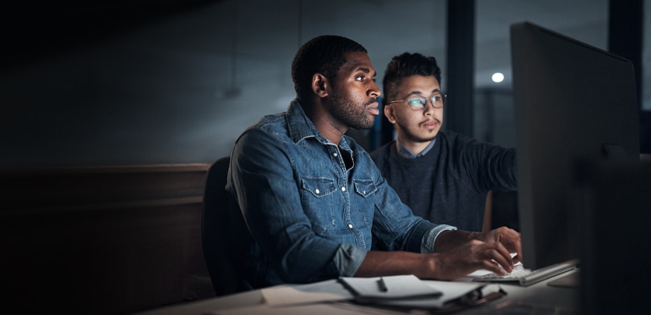 Two people looking at a computer screen